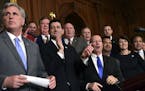 House Republicans, including House Majority Leader Kevin McCarthy of Calif., left, House Speaker Paul Ryan of Wis., fourth from right, and House Ways 