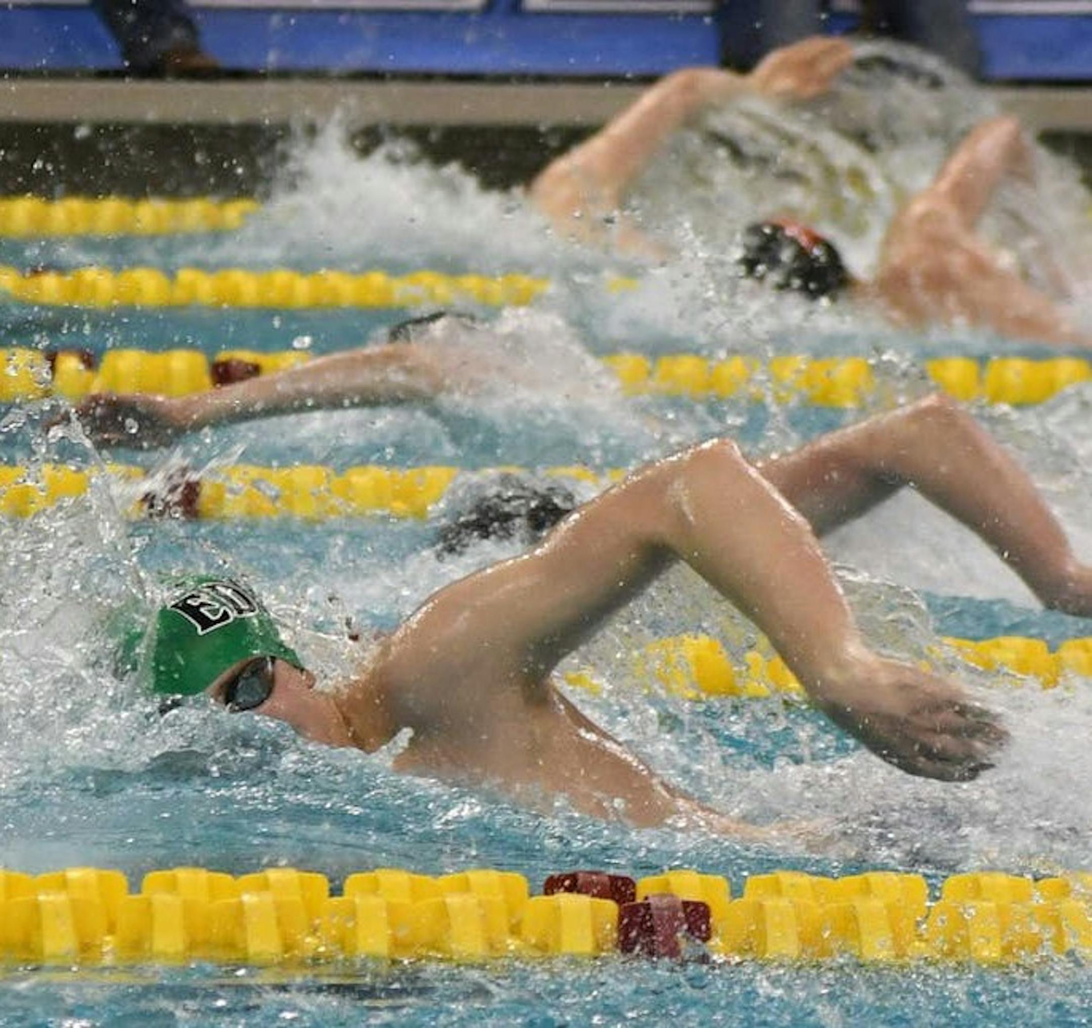 Swimmers compete in the state meet.