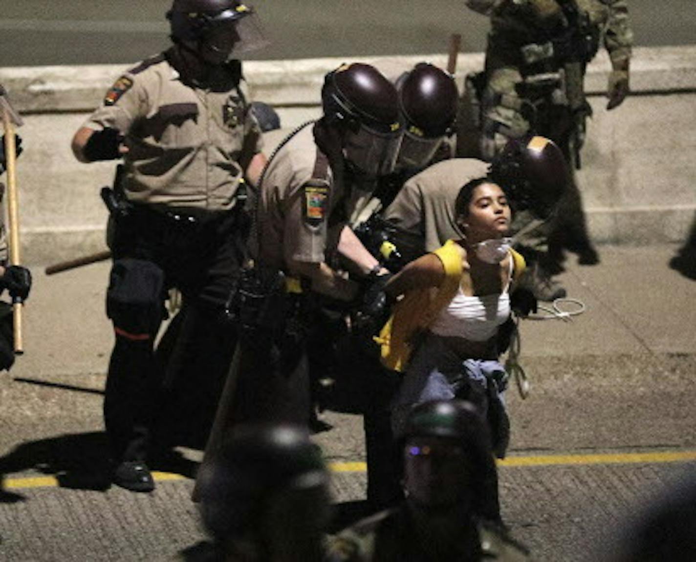 A woman was handcuffed by police as she and several other supporters of Philandro Castile were arrested after they blocked traffic on I-94 near Dale Ave. in protest Friday night in St. Paul. ] ANTHONY SOUFFLE &#xef; anthony.souffle@startribune.com Supporters of Philando Castile held a vigil after St. Anthony police officer Jeronimo Yanez was found not guilty of all counts in the fatal shooting Friday, June 16, 2017 at the State Capitol Building in St. Paul, Minn.