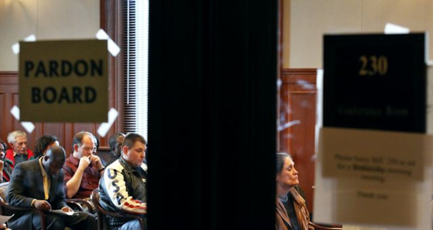 Nancy Davis, right, was not granted a pardon for her assault charge in 1993. Making that decision was the Minnesota Board of Pardons — Gov. Tim Pawlenty, Supreme Court Chief Justice Eric Magnuson and Attorney General Lori Swanson. Fifteen other petitioners, including Gene Matson (in the USA jacket) asked for pardons.