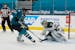 Minnesota Wild goaltender Kaapo Kahkonen (34) defends a shot attempt by San Jose Sharks left wing Evander Kane (9) during the first period of an NHL h