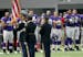 Minnesota Vikings players stand on the field during the playing of the national anthem before an NFL preseason football game against the San Diego Cha