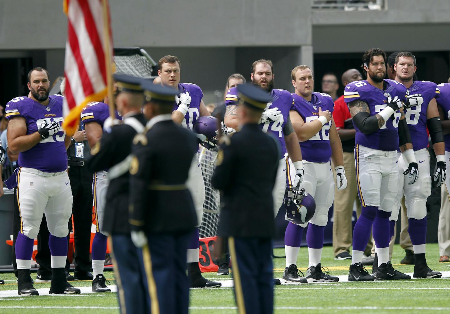 Minnesota Vikings players stand on the field during the playing of the national anthem before an NFL preseason football game against the San Diego Chargers Sunday, Aug. 28, 2016, in Minneapolis. (AP Photo/Andy Clayton-King)