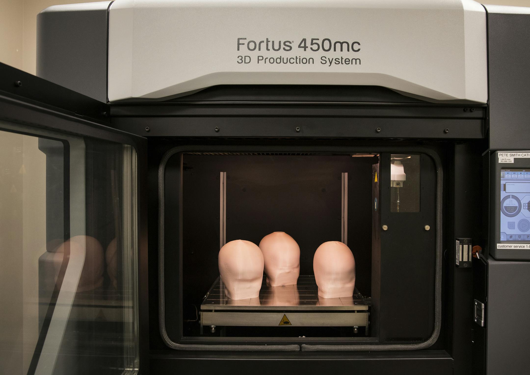 Head models of babies are 3D printed by a Stratasys 3D printer at Gillette Children's Specialty Healthcare's Assistive Technology lab in St. Paul on Monday, July 13, 2015. The models will then be used to make helmets for the babies to treat flat head syndrome. ] LEILA NAVIDI leila.navidi@startribune.com / BACKGROUND INFORMATION: Gillette Children's Speciality Healthcare is now using a Stratasys 3D printer to make molds for skull helmets to treat babies suffering from flat head syndrome.