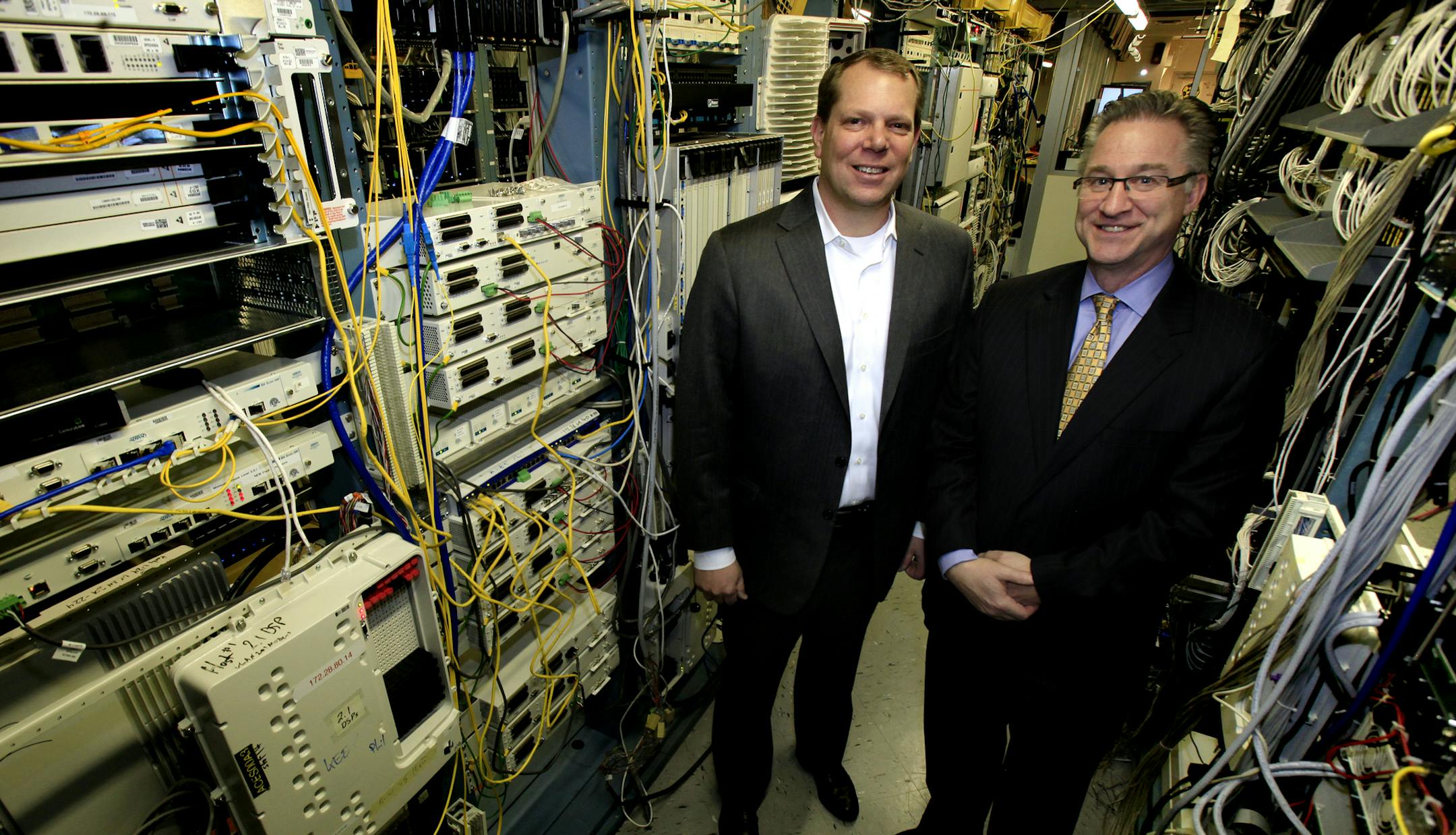 CenturyLink executives Tom Van Sickle (left) and Duane Ring with the computer networking equipment at the CenturyLink facility in Minneapolis, MN on March 4, 2013. ] JOELKOYAMA&#x2022;joel koyama@startribune.com Executives from CenturyLink (Duane Ring) and Savvis (Tom Van Sickle), who are both based in the Twin Cities, will pose with some computer networking equipment at a CenturyLink facility in Minneapolis. Savvis, a Missouri-based subsidiary of local phone company CenturyLink. Savvis provides