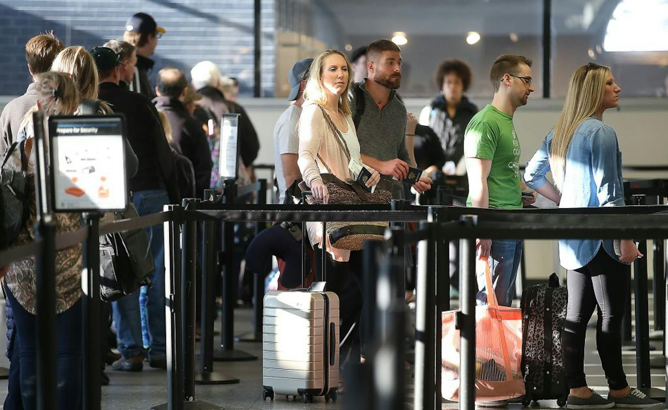 TSA security moved people through as they made their way to the security line at Terminal one at Minneapolis/St. Paul International Airport, Friday, March 11, 2016 in Bloomington, MN.