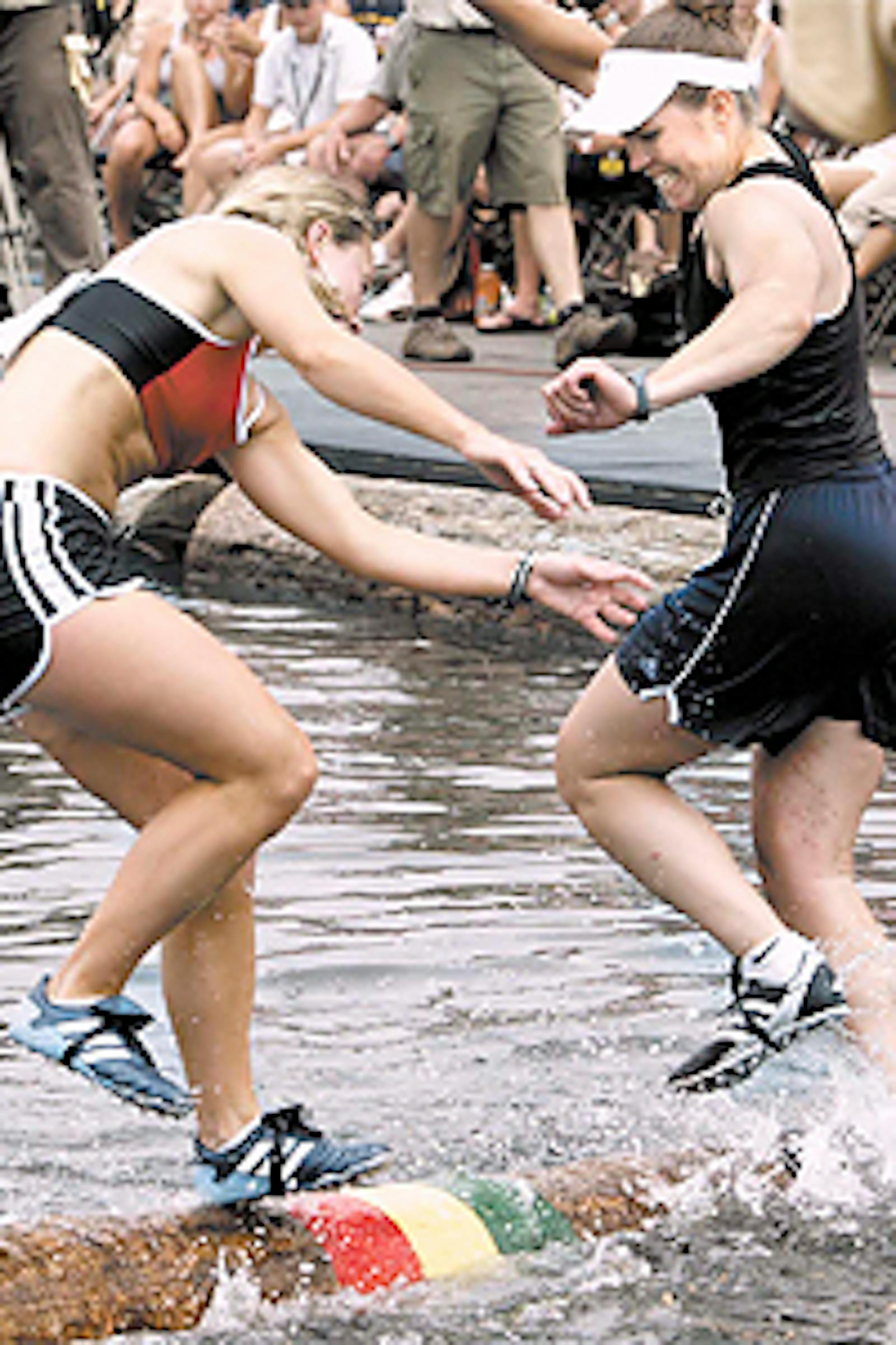 Lizzie Hoeschler (now Horvitz, left) and Tina Bosworth battled for the gold medal in women's log rolling at the 2004 Great Outdoors Games Championship. (Bosworth won.)