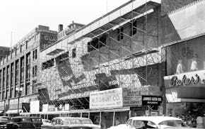 A bustling Nicollet Avenue between S. 6th Street and S. 7th Street photographed April 19, 1955.