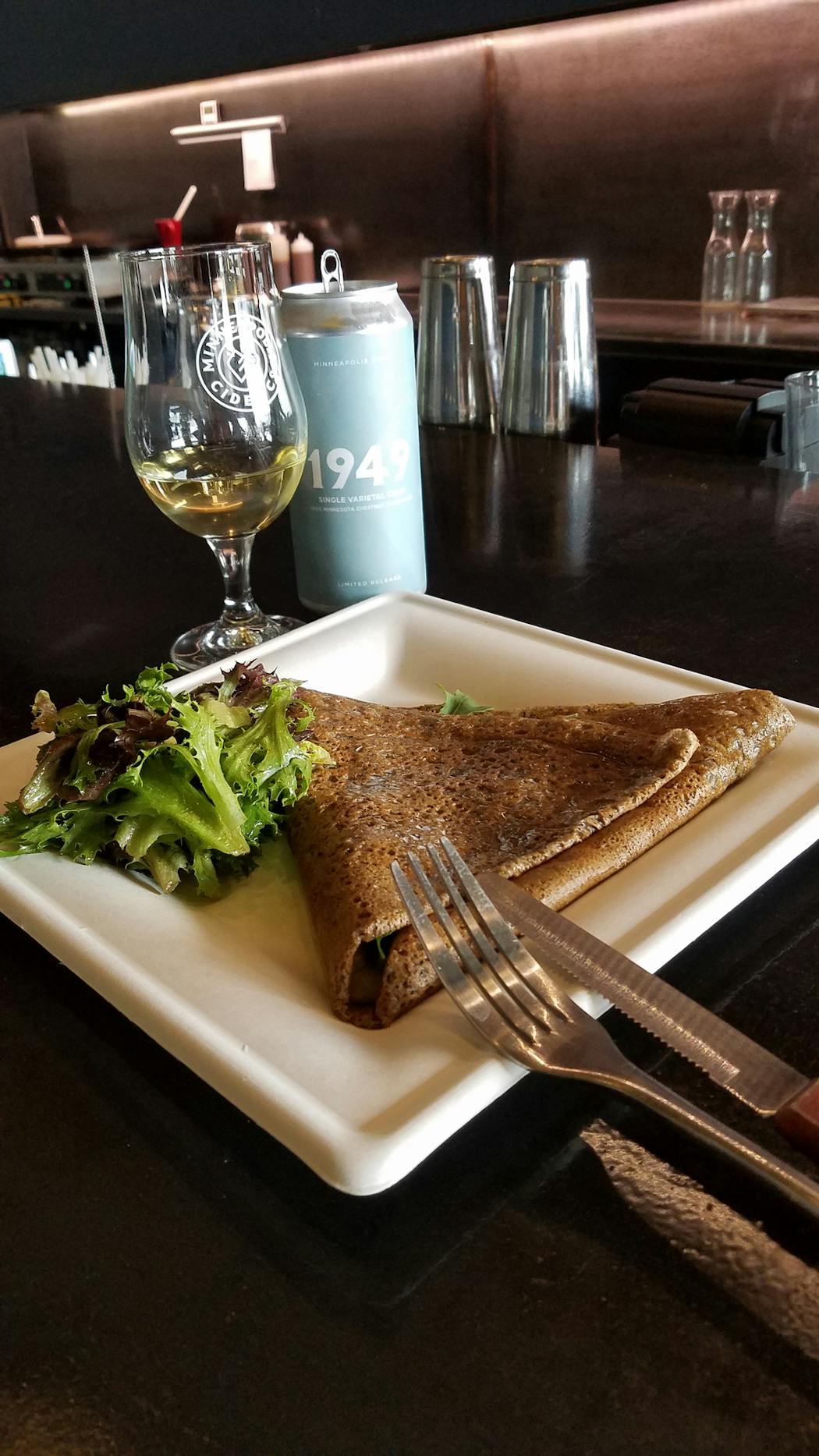 A brie galette — Brie, honey, bacon and arugula — and the 1949 single varietal chestnut crab cider at Minneapolis Cider Co. complement each other.