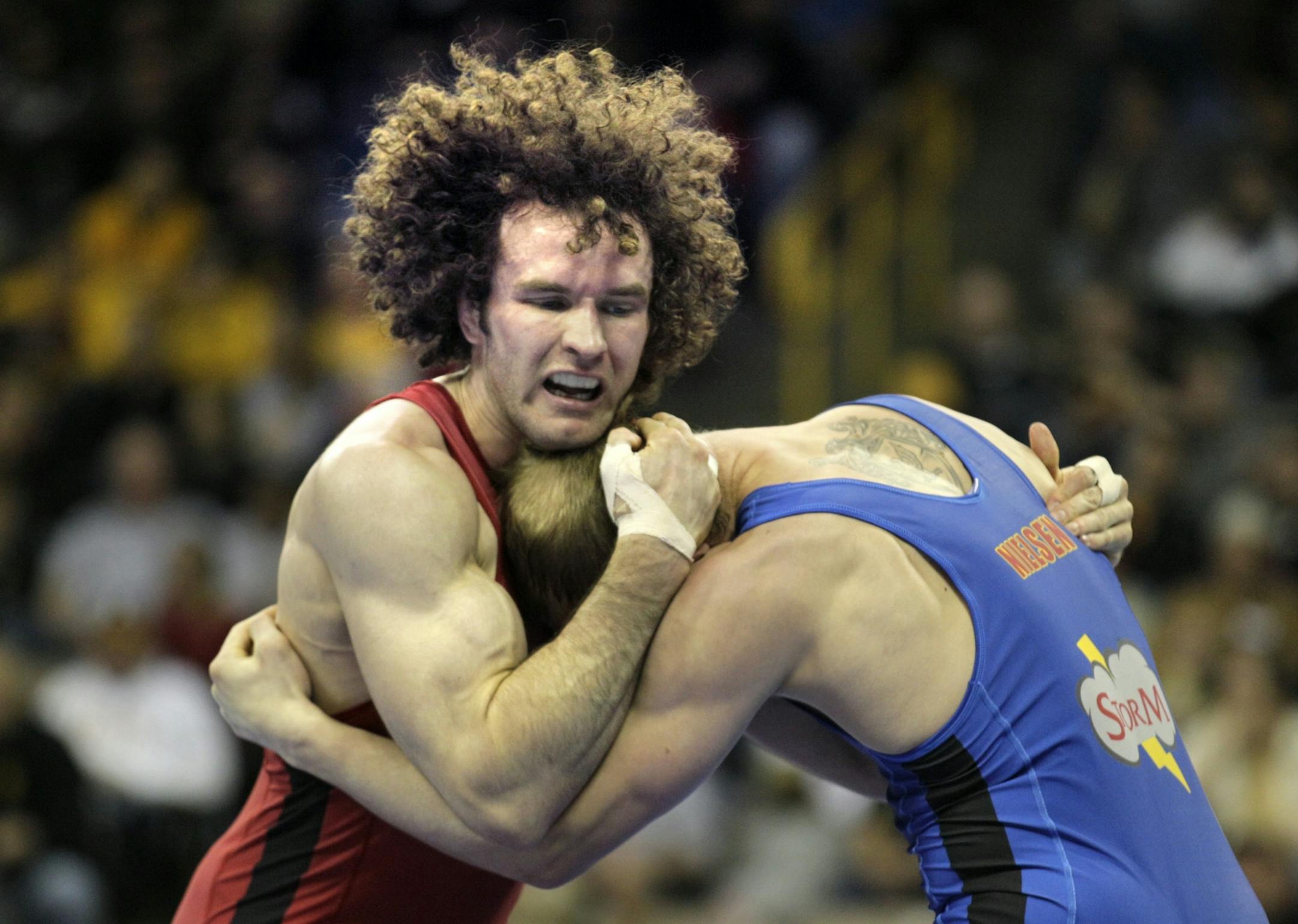 Olympic Wresting Trials (IN THIS PHOTO) Jordan Holm tangles with Zac Nielson (Alos of Minnesota) during the challenge round Saturday morning. Holm beat Nielson to advance to the finals Saturday night. Holm will wrestle Chas Betts for the trip to London Olympics.