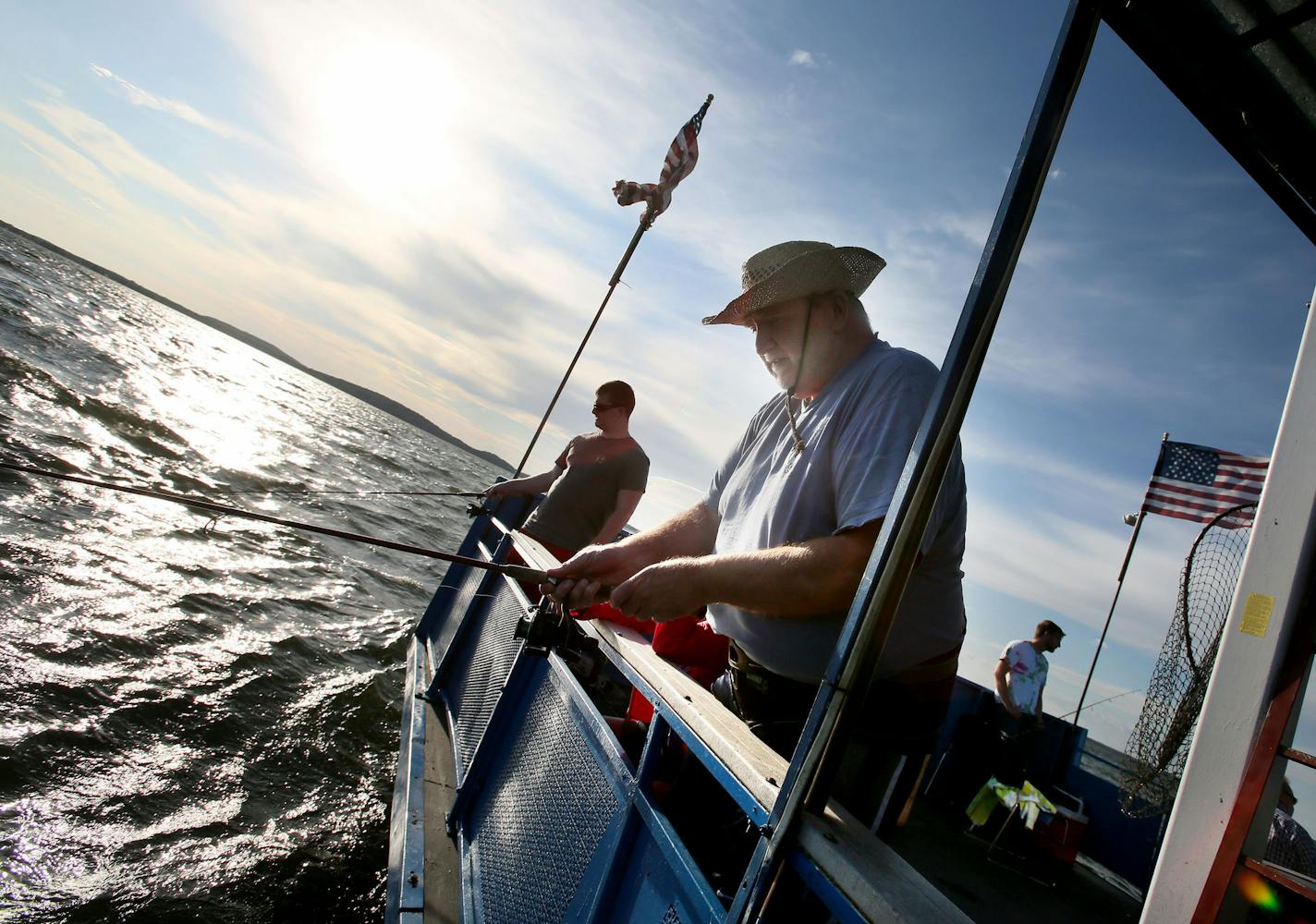 David Hill, front, of Brooklyn Park, and his son Carl, rear left, fish for walleye on the Twin Pines Resort boat Wednesday, July 29, 2015, during an evening excursion on Lake Mille Lacs.](DAVID JOLES/STARTRIBUNE)djoles@startribune.com The walleye crisis on Mille Lacs sparked a fresh round of fingerpointing, and fewer targets take more blame than the Mille Lacs Band of Ojibwe and the other bands who net fish in the shallows during spawning season. The racial tensions have always been there, but n