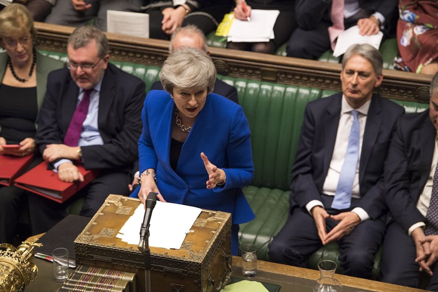 Britain's Prime Minister Theresa May speaks during a debate before a no-confidence vote on Theresa May raised by opposition Labour Party leader Jeremy Corbyn, in the House of Commons, London, Wednesday Jan. 16, 2019. In a historic defeat for the government Tuesday, Britain's Parliament discarded May's Brexit deal to split from the European Union, and May now faces a parliamentary vote of no-confidence Wednesday.