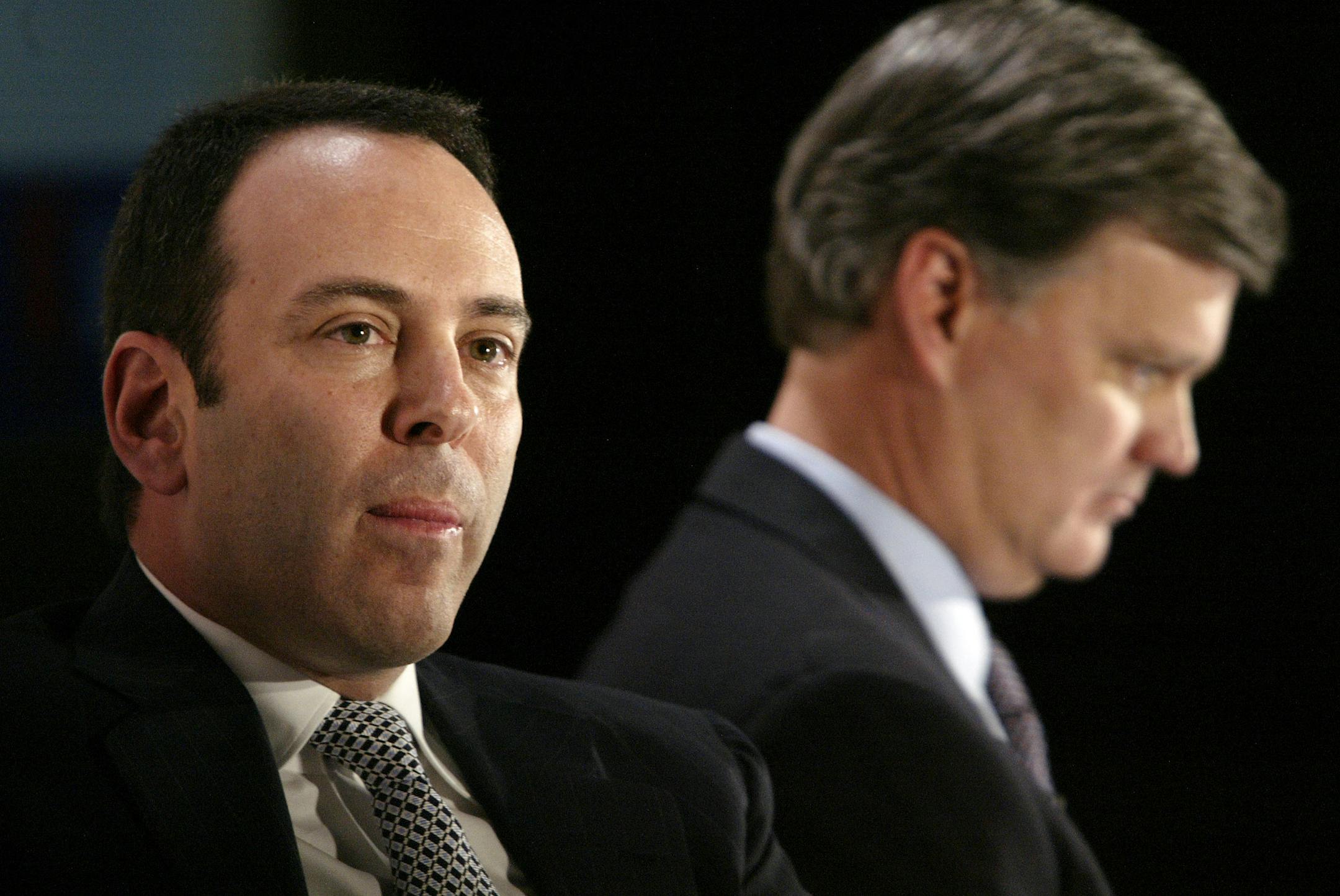 Kmart chairman Edward Lampert, left, and Sears CEO Alan Lacy listen during a news conference to announce the merger of Kmart and Sears in New York Wednesday, Nov. 17, 2004. Kmart is acquiring Sears in a surprise $11 billion deal that will create the nation's third-largest retailer. (AP Photo/Gregory Bull) ORG XMIT: NYGB103