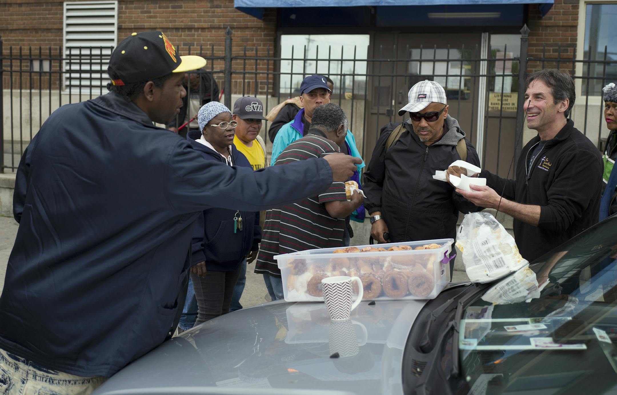 Chris Engelmann right gave donuts to people at the Listening House of St. Paul Tuesday May 10, 2016 in St. Paul, MN.] Chris Engelmann loaded donuts from the SugaRush bakery that he gives to homeless shelters, hospices, street people and even late-night concertgoers. Jerry Holt /Jerry.Holt@Startribune.com