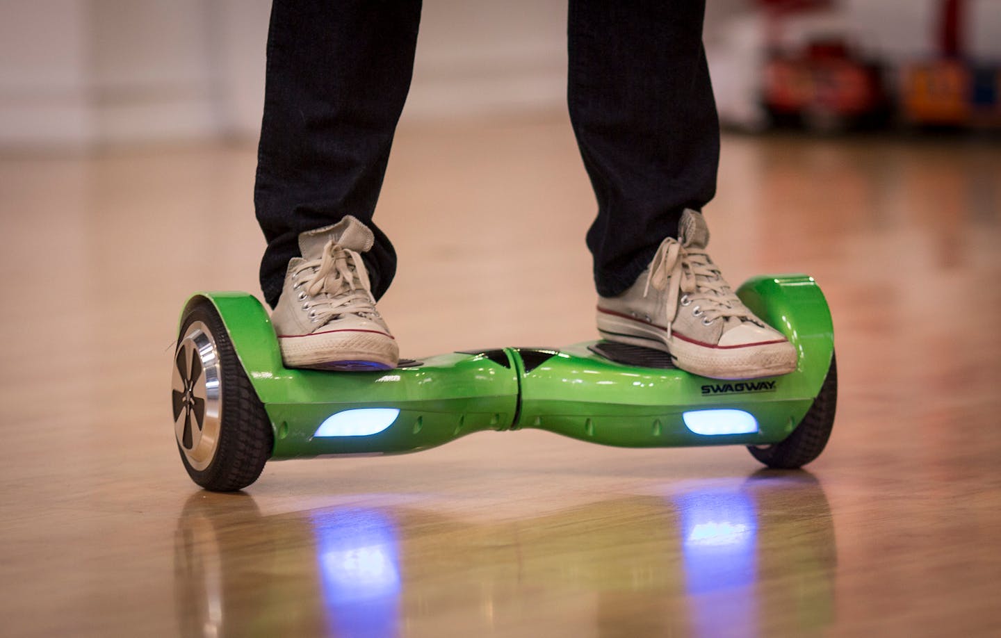 Host Sasha Andreev riding a Swagway.