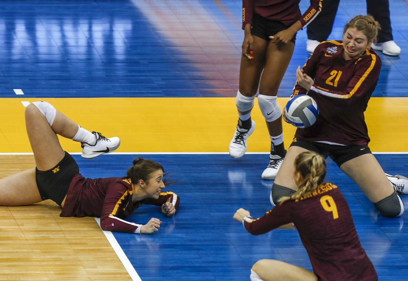 Minnesota's Rachel Kikelley, left, Regan Pittman (21) and Shea Rubright (9) can't make a play on a Stanford spike during the semifinals of the NCAA Division I women's volleyball championships Thursday, Dec. 19, 2019, in Pittsburgh. Stanford won and will face Wisconsin in the championship match Saturday. (AP Photo/Keith Srakocic)