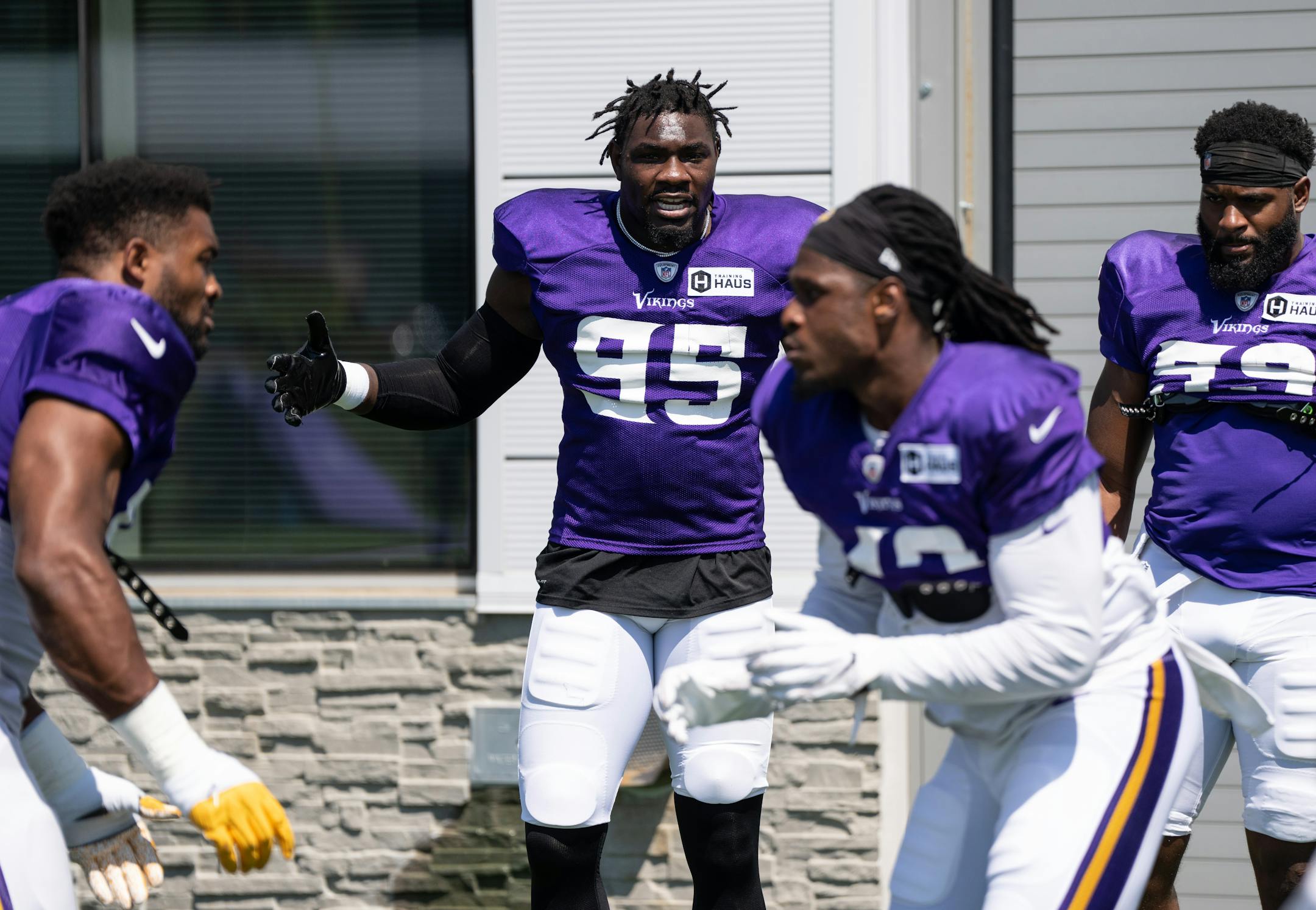 Vikings defensive line Janarius Robinson (95) cheers on teammates during Vikings Training Camp at TCO Performance Center on Friday, Aug. 5, 2022 in Eagan, Minn.