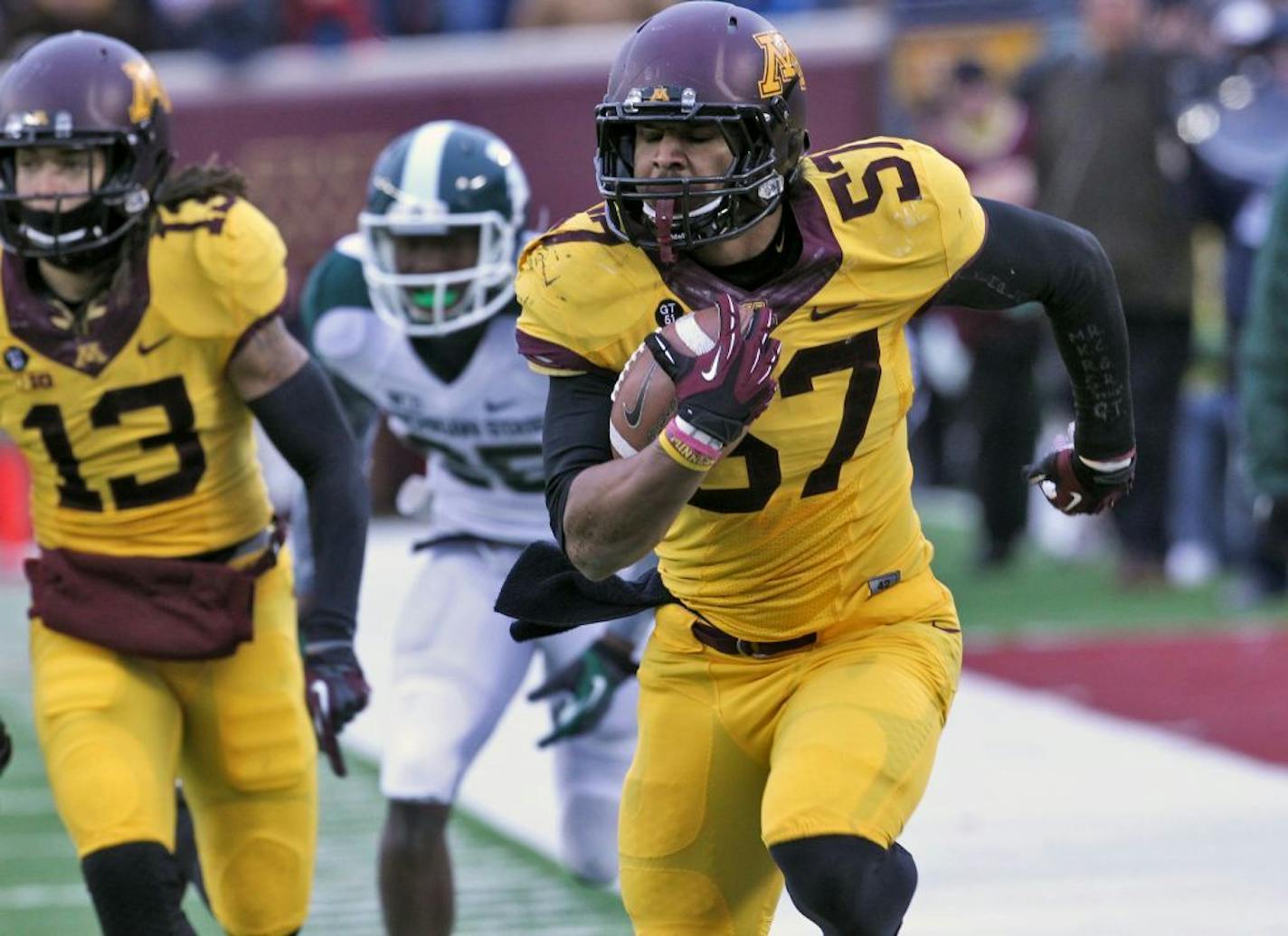 Gophers linebacker Aaron Hill intercepted a Spartans pass