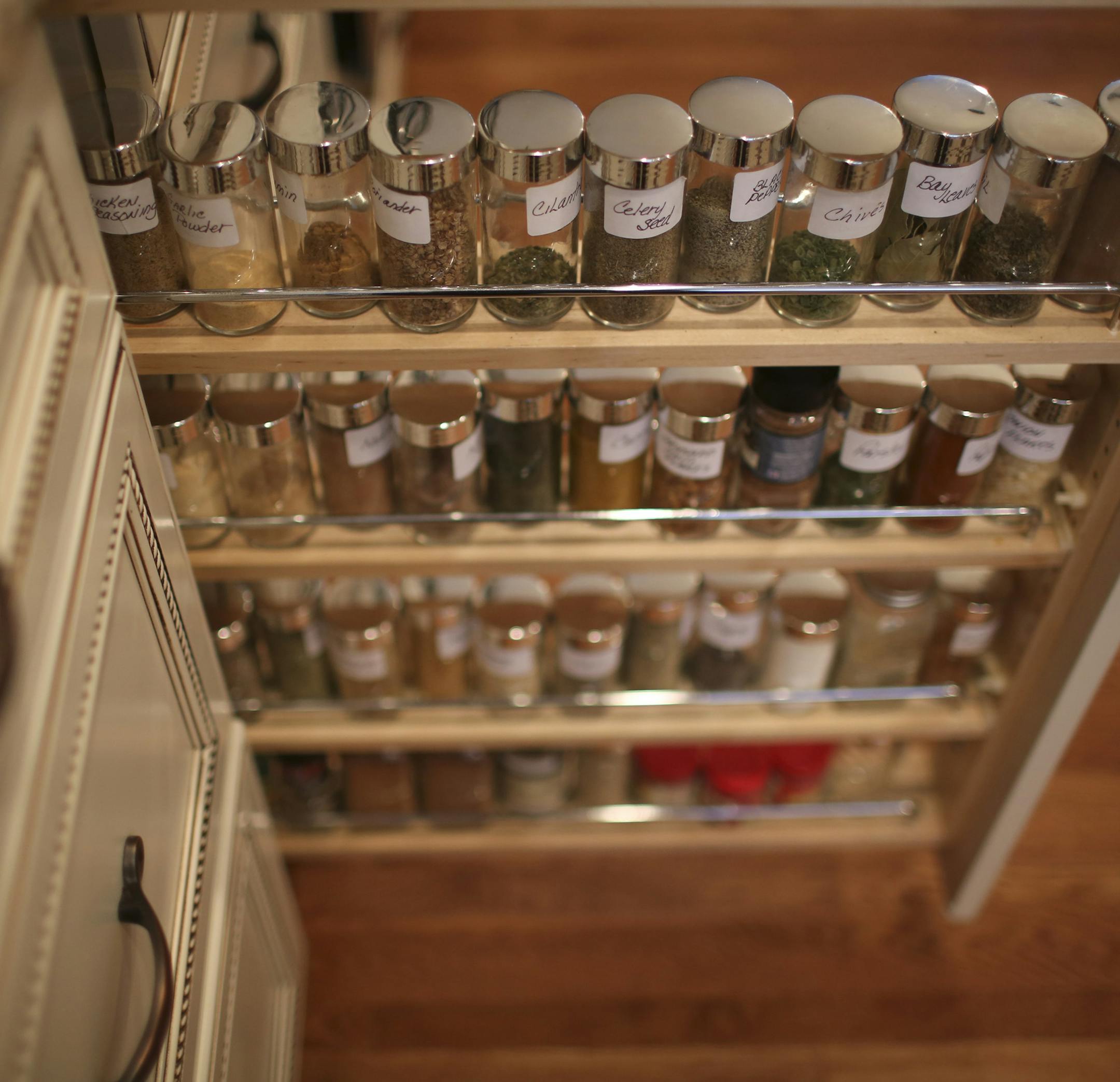 Pat and Gene Swiridow's 1970s rambler remodel and addition will be open for tours on the 2013 Remodelers Showcase, March 22-24. Their kitchen and hearth room addition were photographed Monday afternoon, March 11, 2013 in Eagan, Minn. Among the built -ins that Pat Swiridow appreciates in her new kitchen is the pull out spice rack. ] JEFF WHEELER ‚Ä¢ jeff.wheeler@startribune.com