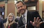 In this Jan. 14, 2015 photo, Rep. Cindy Gamrat, R-Plainwell, and Rep Todd Courser, R-Lapeer wave to reporters in the House of Representatives in Lansi