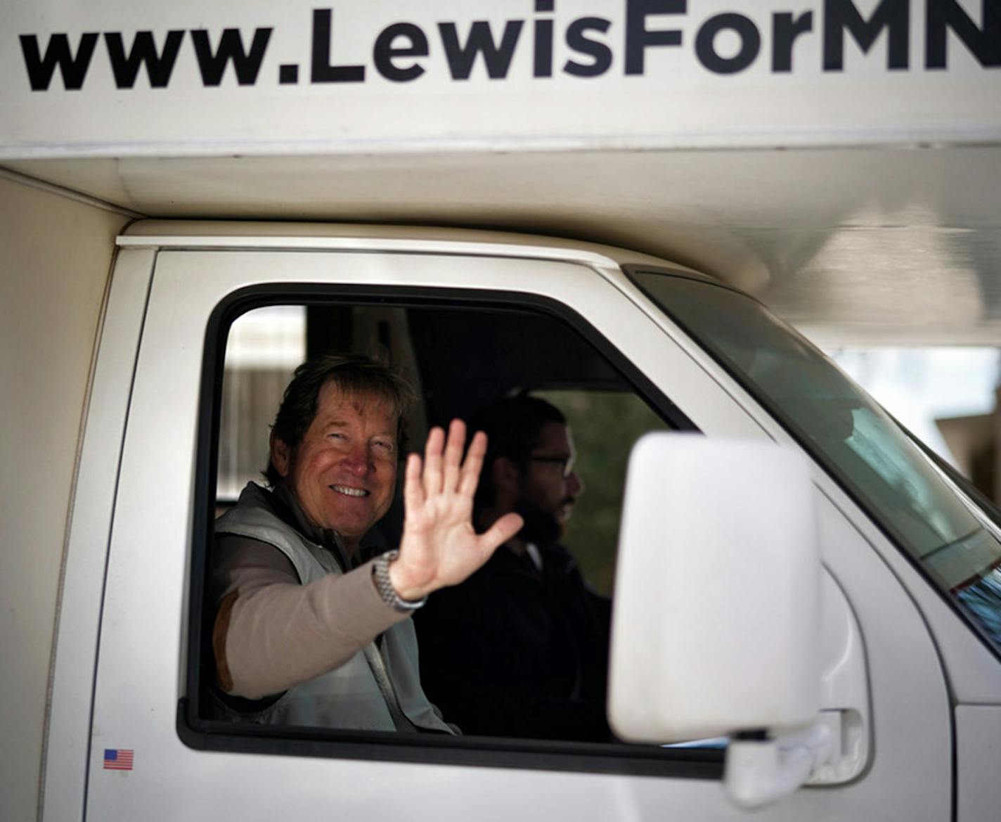 Republican U.S. Senate candidate Jason Lewis reached out to protesters from his RV in April during a "Liberate Minnesota" protest in St. Paul.