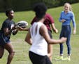 Olympic Rugby player Kathryn Johnson (right) watched as the Hopkins High School girls hockey team worked on drills at Valley Park Monday May 8, 2017 i