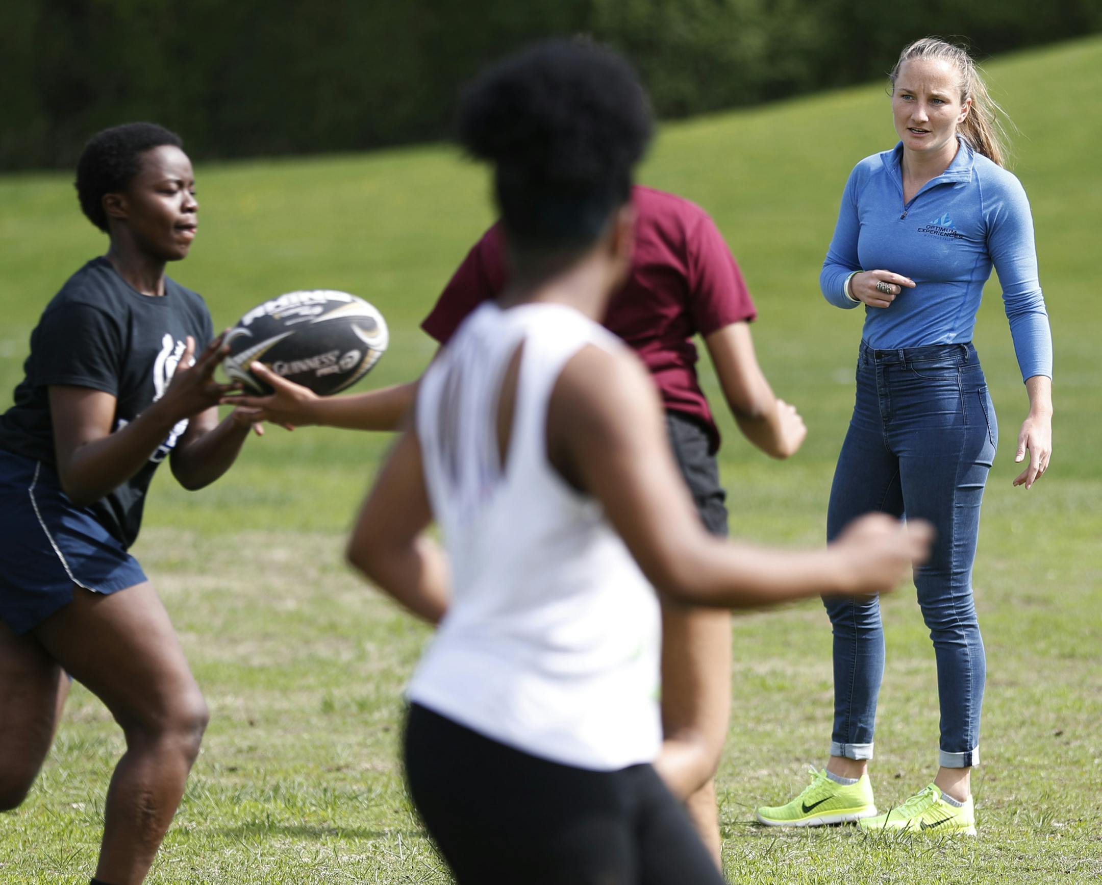 Olympic Rugby player Kathryn Johnson (right) watched as the Hopkins High School girls hockey team worked on drills at Valley Park Monday May 8, 2017 in Hopkins, MN. ] JERRY HOLT &#xef; jerry.holt@startribune.com