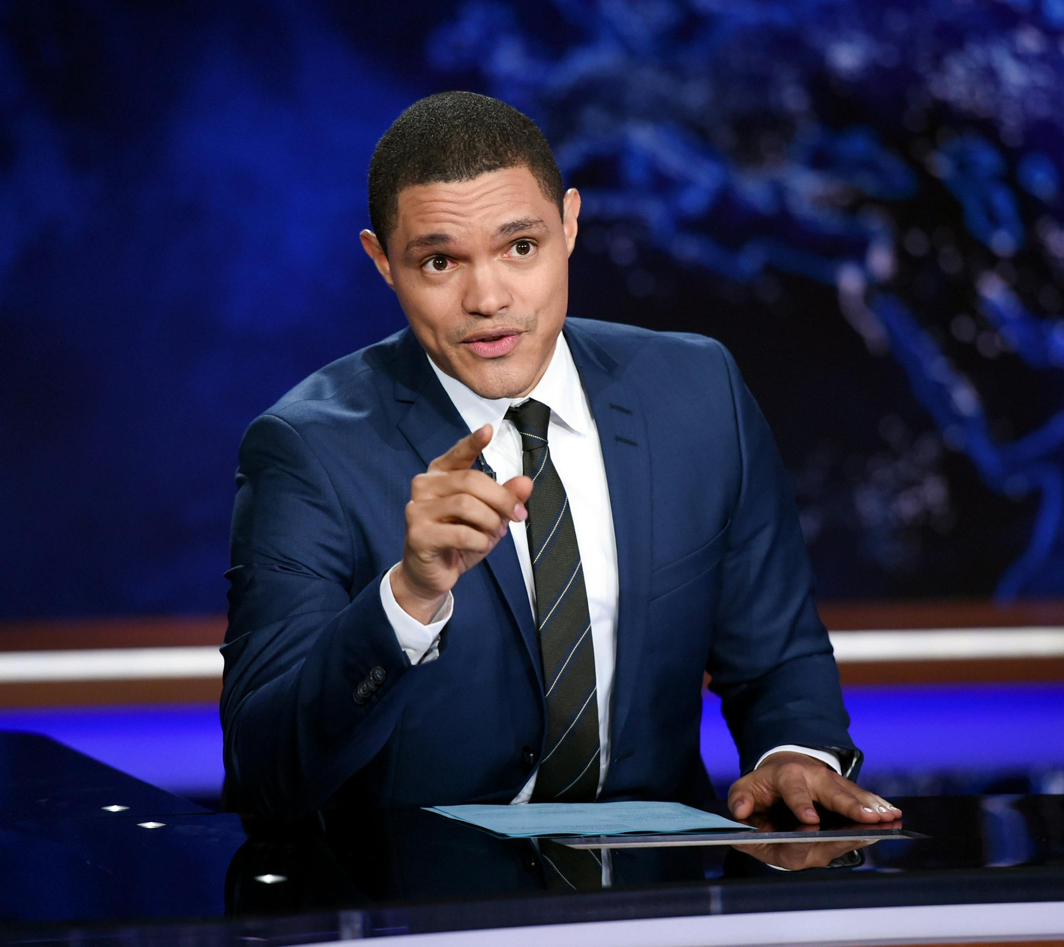 FILE - In this Sept. 29, 2015, file photo, Trevor Noah works on set during a taping of "The Daily Show with Trevor Noah" in New York. As they returned to work after Sunday morning's mass shooting in a gay nightclub in Orlando, Fla.,, TV's late-night hosts faced the challenge none of them looks forward to. They had to find a way to bond with their viewers, as they do every night, but with shared feelings unrelieved by the comfort of comedy. That is what Noah did Monday, June 13, 2016. (Photo by E