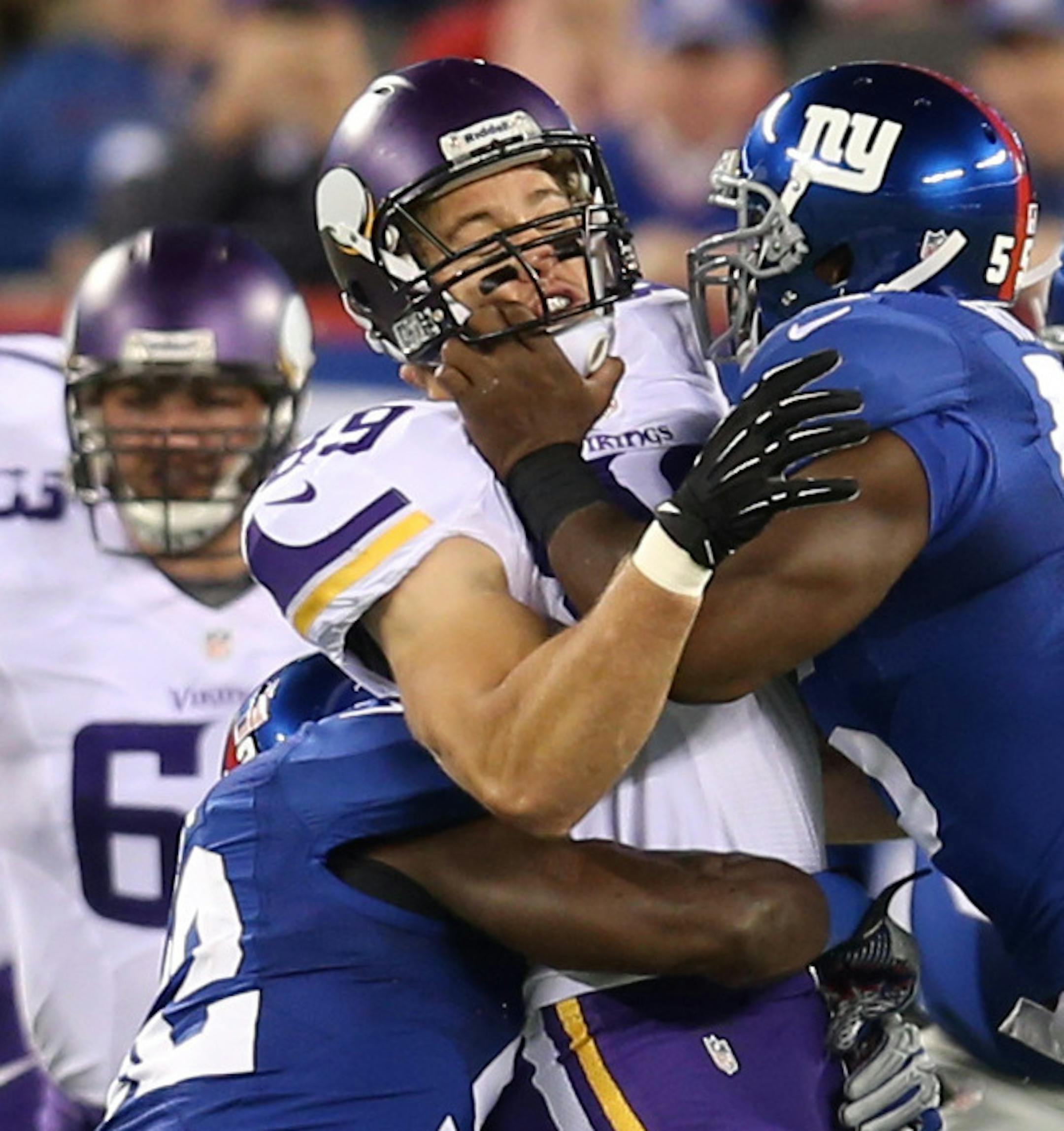 Linebackers Keith Rivers and and Jon Beason hit tight end John Carlson and forced him to drop a pass in the first quarter. ] Minnesota Vikings and New York Giants - MetLife Stadium in East Rutherford, New Jersey. MCKENNA EWEN &#xb7; mckenna.ewen@startribune.com Minneapolis, Minn. - 10/21/2013