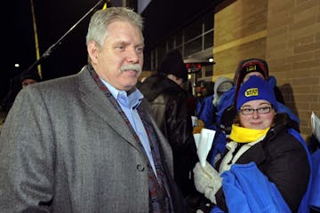 FILE -- Nov. 2010: In this photograph taken by AP Images for Best Buy, Brian Dunn greets shoppers waiting for the Eden Prairie Best Buy to open for Bl