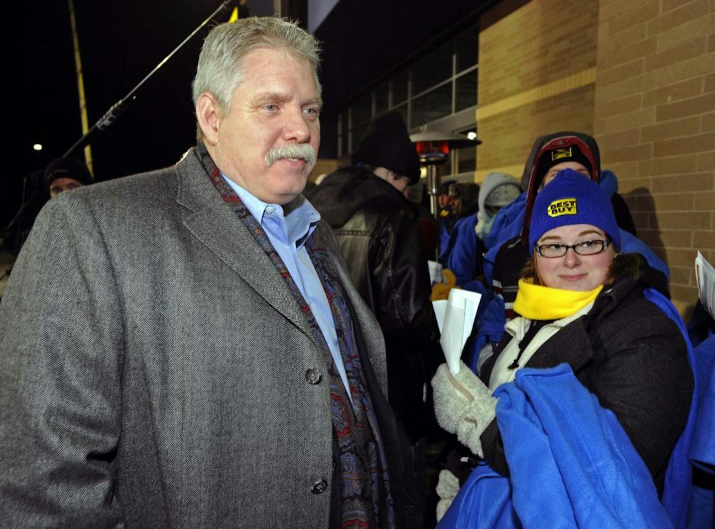 FILE -- Nov. 2010: In this photograph taken by AP Images for Best Buy, Brian Dunn greets shoppers waiting for the Eden Prairie Best Buy to open for Black Friday.