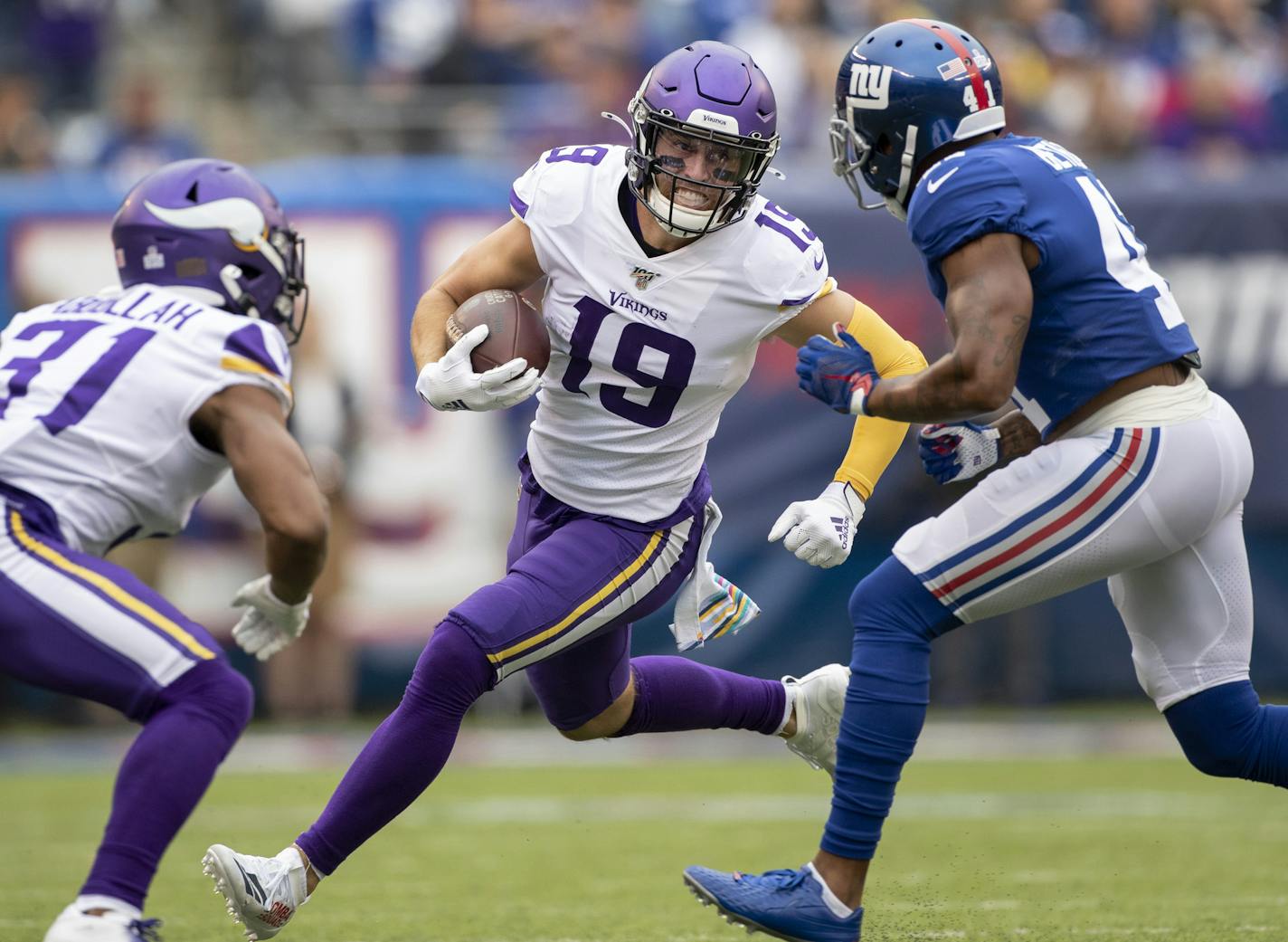 Adam Thielen tried to gain yardage after a first-half reception Sunday.