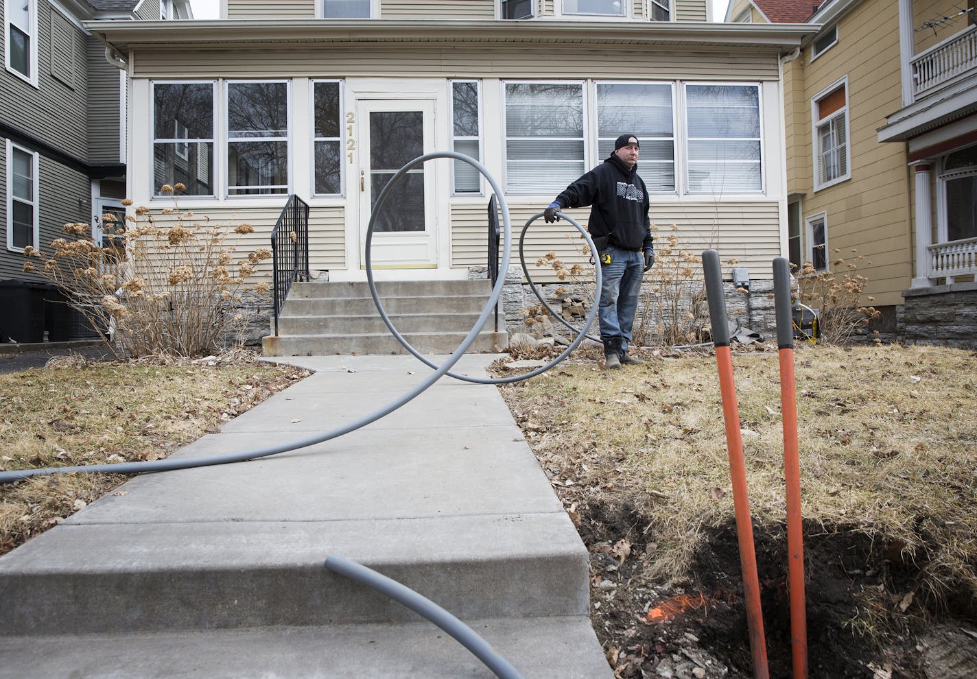 Jesse Milhem, with US Internet, inserted a pipe that will connect a home to the underground fiber optic system in south Minneapolis.