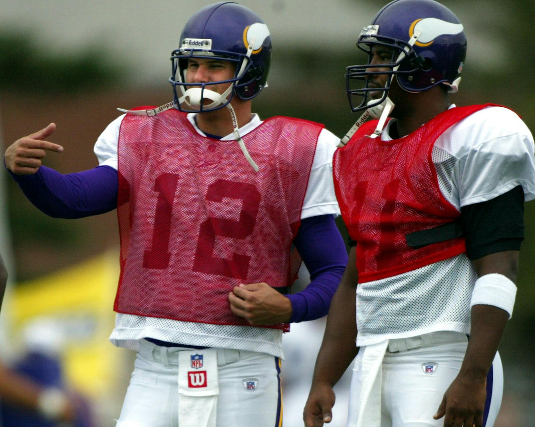 August 6, 2002 Minnesota Vikings Training camp-- Minnesota State University Mankato Minnesota Vikings quarterbacks Romaro Miller, #14, Shaun Hill, #12, and Daunte Culpepper, during the morning practice of Training Camp in Mankato, MN on Tuesday. Miller, Hill and Spergon Wynn are all competing for the 3rd quarterback spot on the team. ORG XMIT: MIN2015031021324369