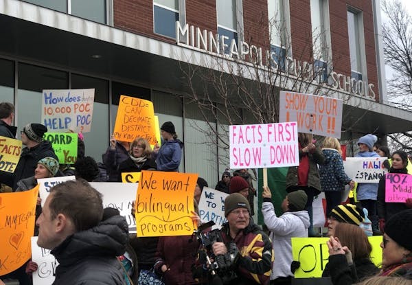 Coalition of people opposed to the Minneapolis school district's restructuring plan (CDD) rallied before the 5:30 pm school board meeting - calling on