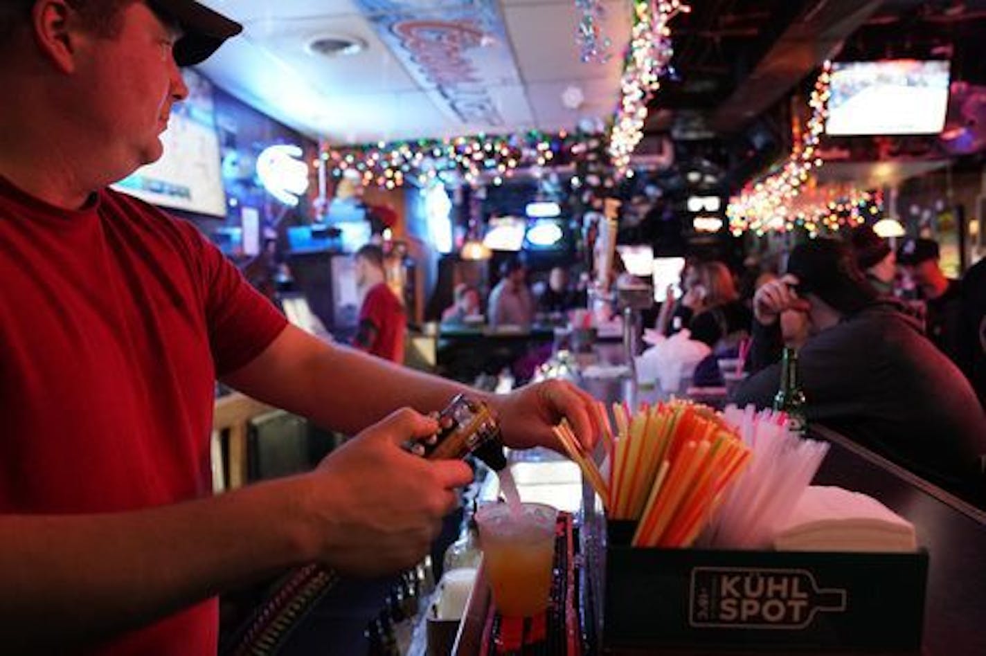 Bartender Todd Brinwall made a mixed drink as the night started to get busy at Danno's bar Friday.