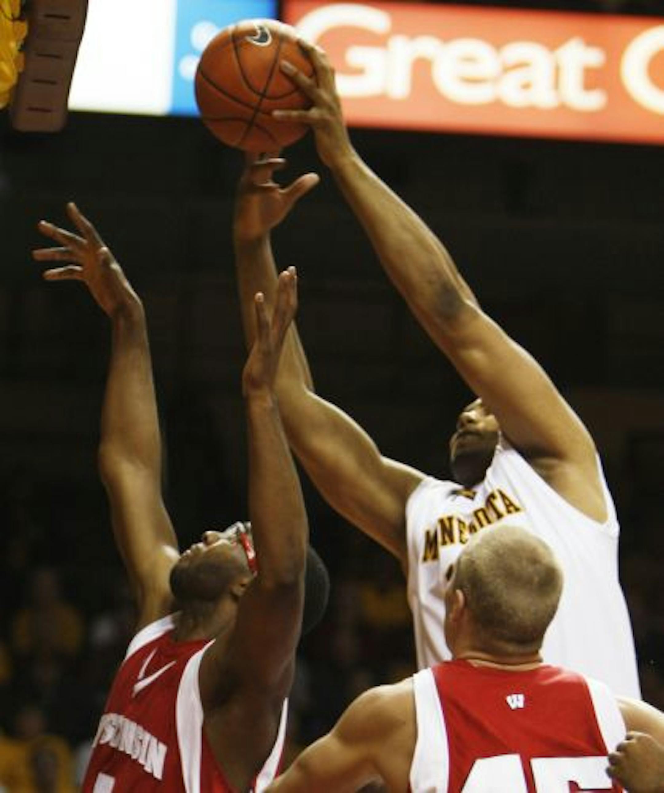 Gophers Jonathan Williams(11) snatched a rebound from Marcus Landry(1).