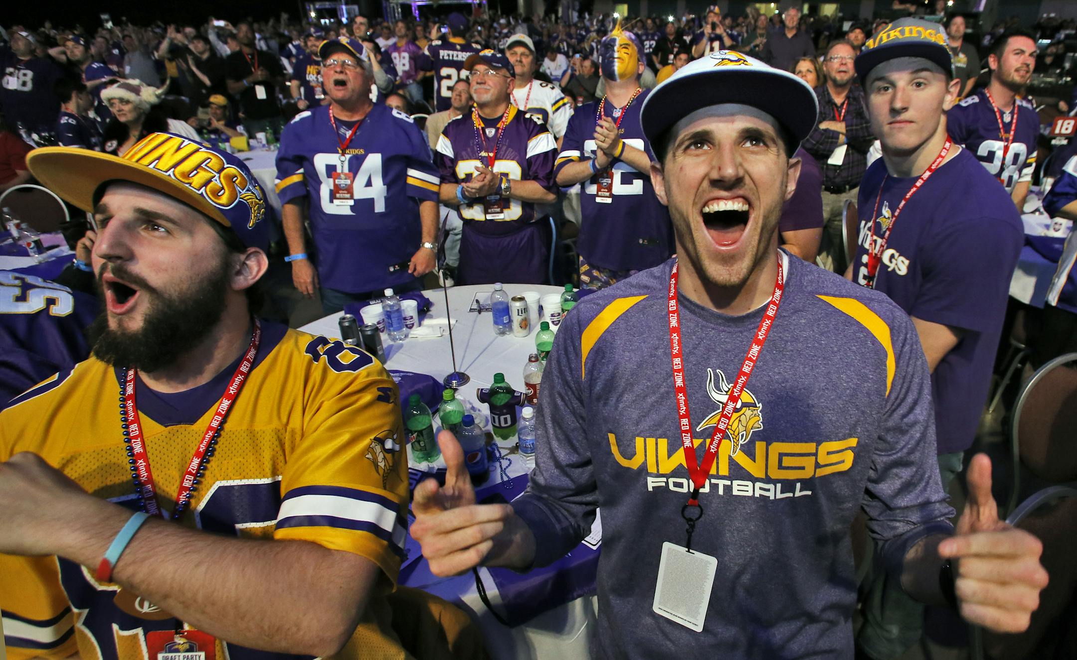 Vikings fans Beau Hansen, Woodbury, left, and Josh Hansen, Eagen showed surprise and jubilation at the Vikings first round pick of Anthony Barr. ] Vikings draft party at Minneapolis Convention Center. (MARLIN LEVISON/STARTRIBUNE(mlevison@startribune.com)