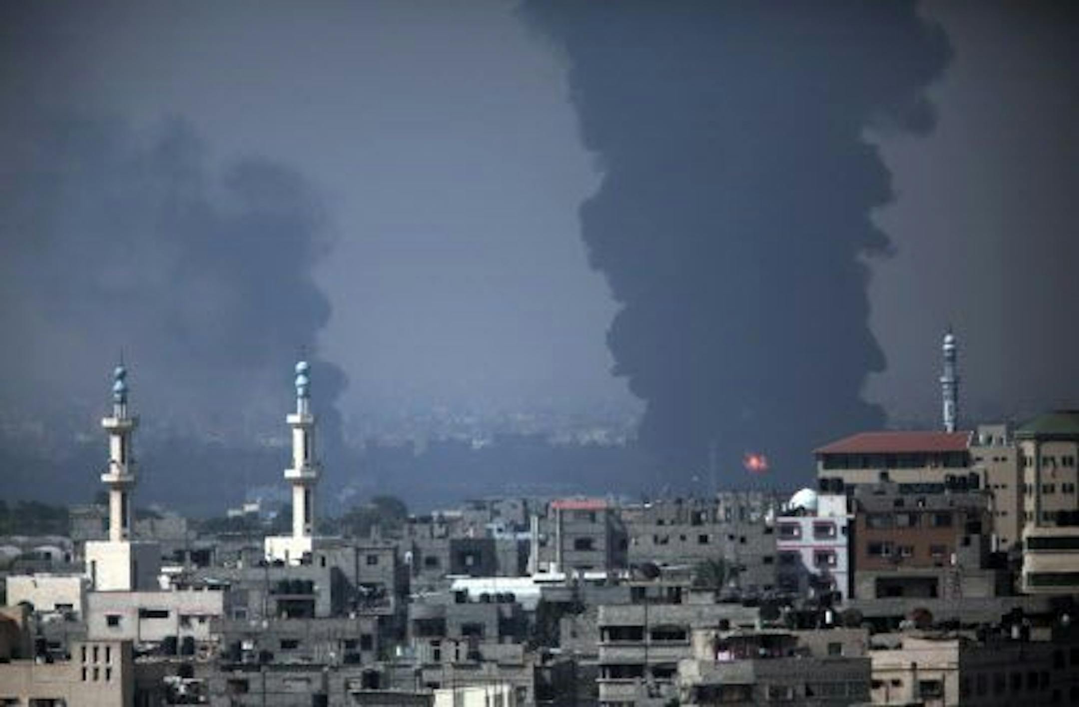 Smoke rises from Gaza's electricity distribution company after it was hit by Israeli strikes in the Nusayrat refugee camp, central Gaza Strip, Tuesday, July 29, 2014.