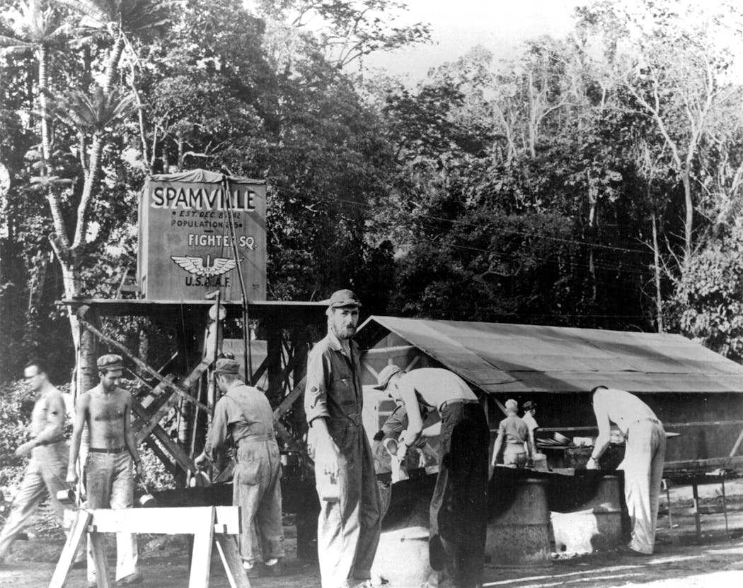 Service members in 1943 at an Army Air Corps camp in the Pacific that was dubbed Spamville.