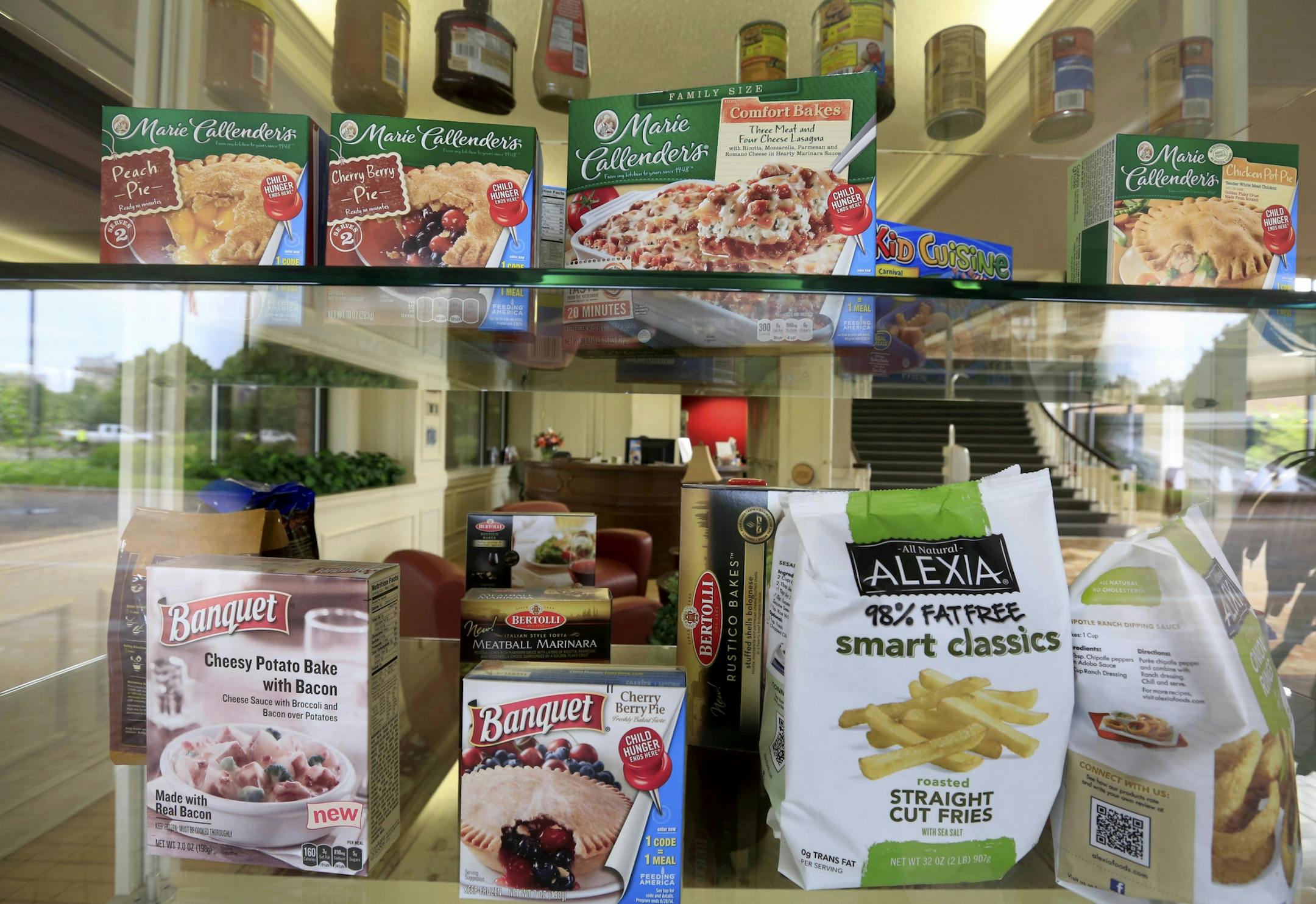 A selection of products made by ConAgra Foods is on display at ConAgra world headquarters in Omaha, Neb., Tuesday, June 30, 2015. ConAgra Foods Inc. plans to sell its faltering business that makes store-brand packaged food just two years after spending $5 billion to beef it up by buying the private-label food maker Ralcorp. (AP Photo/Nati Harnik)