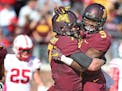 Minnesota's wide receiver Eric Carter was lifted by quarterback Mitch Leidner after scoring a first quarter touchdown against Nebraska last season. Wi