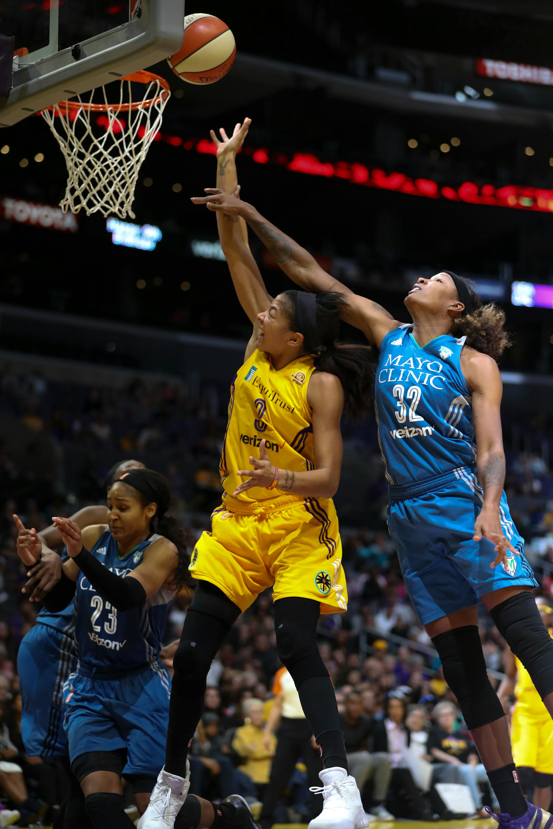 Los Angeles Sparks forward Candace Parker (3) missed a late fourth quarter shot while defended by Minnesota Lynx forward Rebekkah Brunson (32).