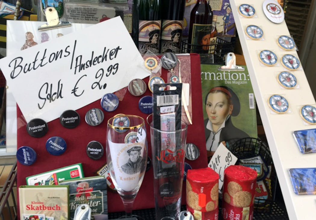 Martin Luther-themed paraphernalia, ranging from pins to cookies to refrigerator magnets, lure passing tourists in Wittenberg.