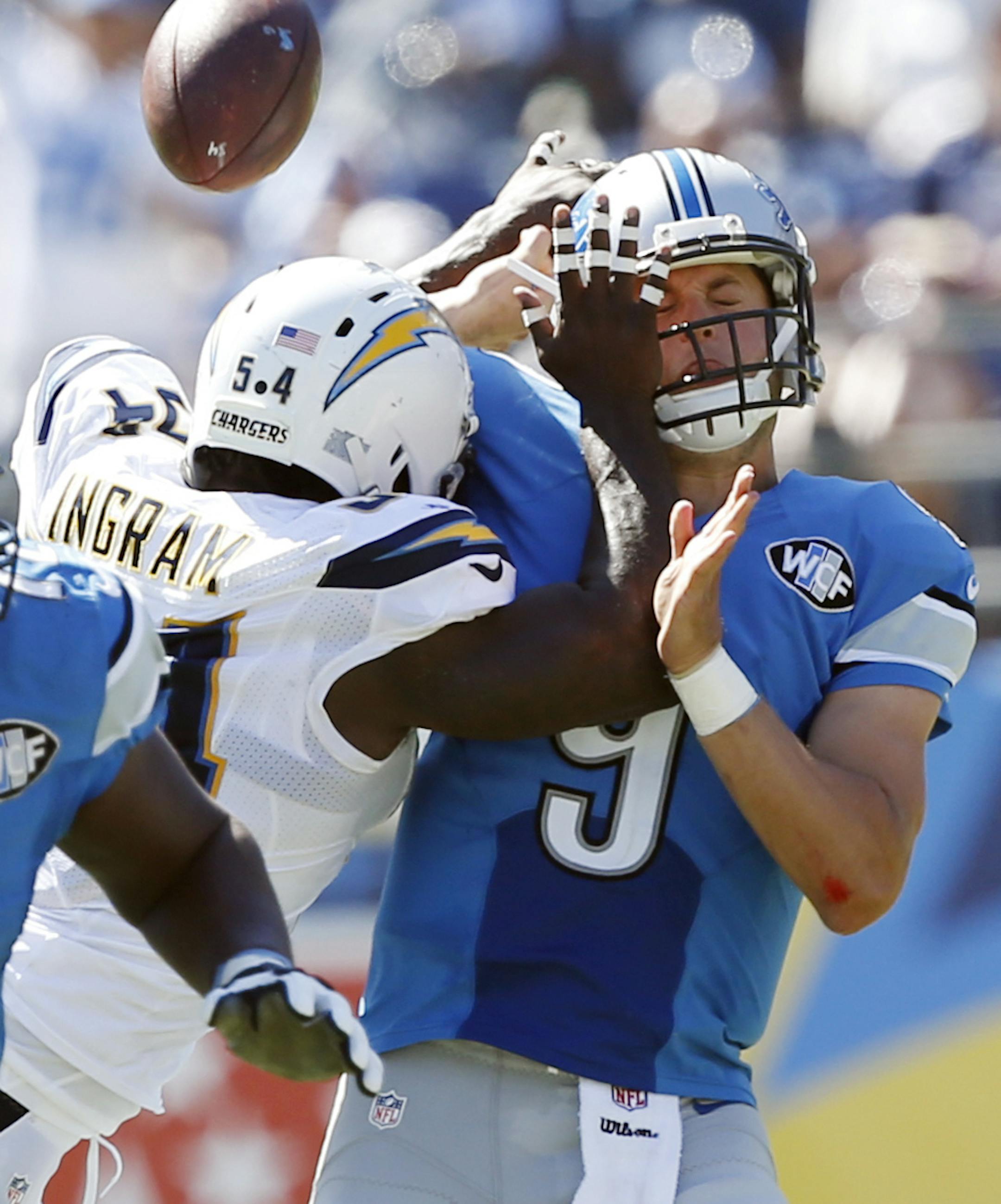 Detroit Lions quarterback Matthew Stafford (9) is hit by San Diego Chargers outside linebacker Melvin Ingram during the second half of an NFL football game Sunday, Sept. 13, 2015, in San Diego. The tipped ball led to an interception for the Chargers. (AP Photo/Alex Gallardo) ORG XMIT: CAGB120