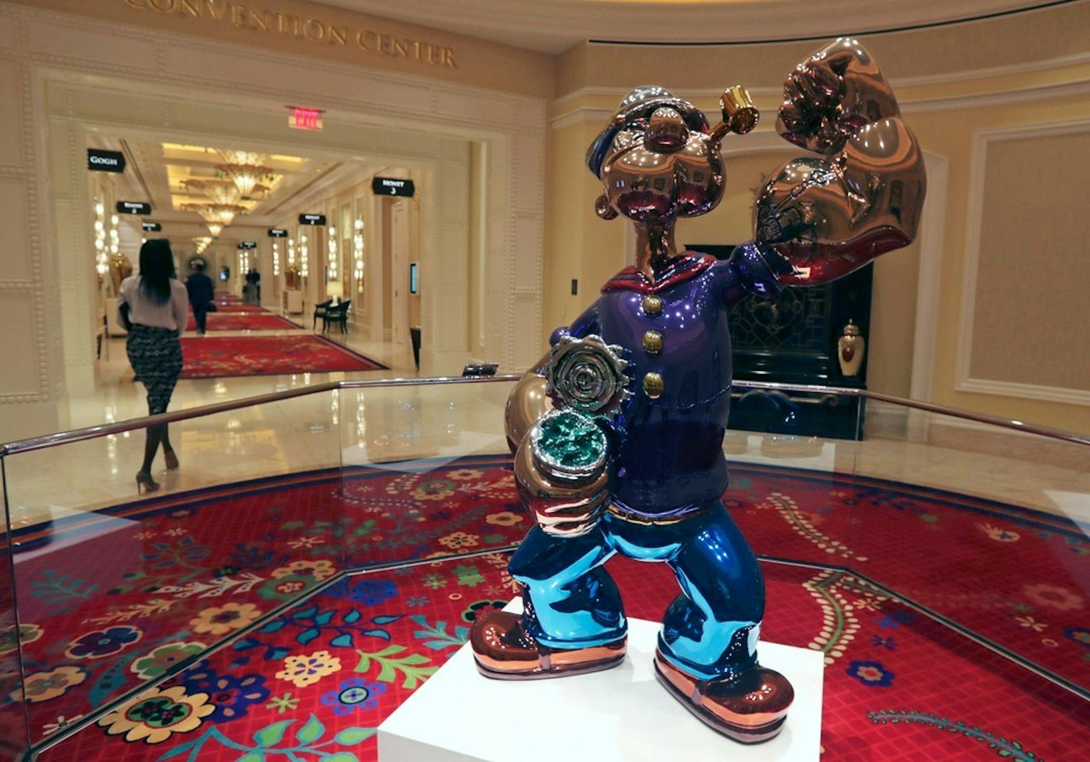 In June, a woman walked past a giant Popeye sculpture by artist Jeff Koons displayed in a corridor at the Encore Boston Harbor casino in Everett, Mass.