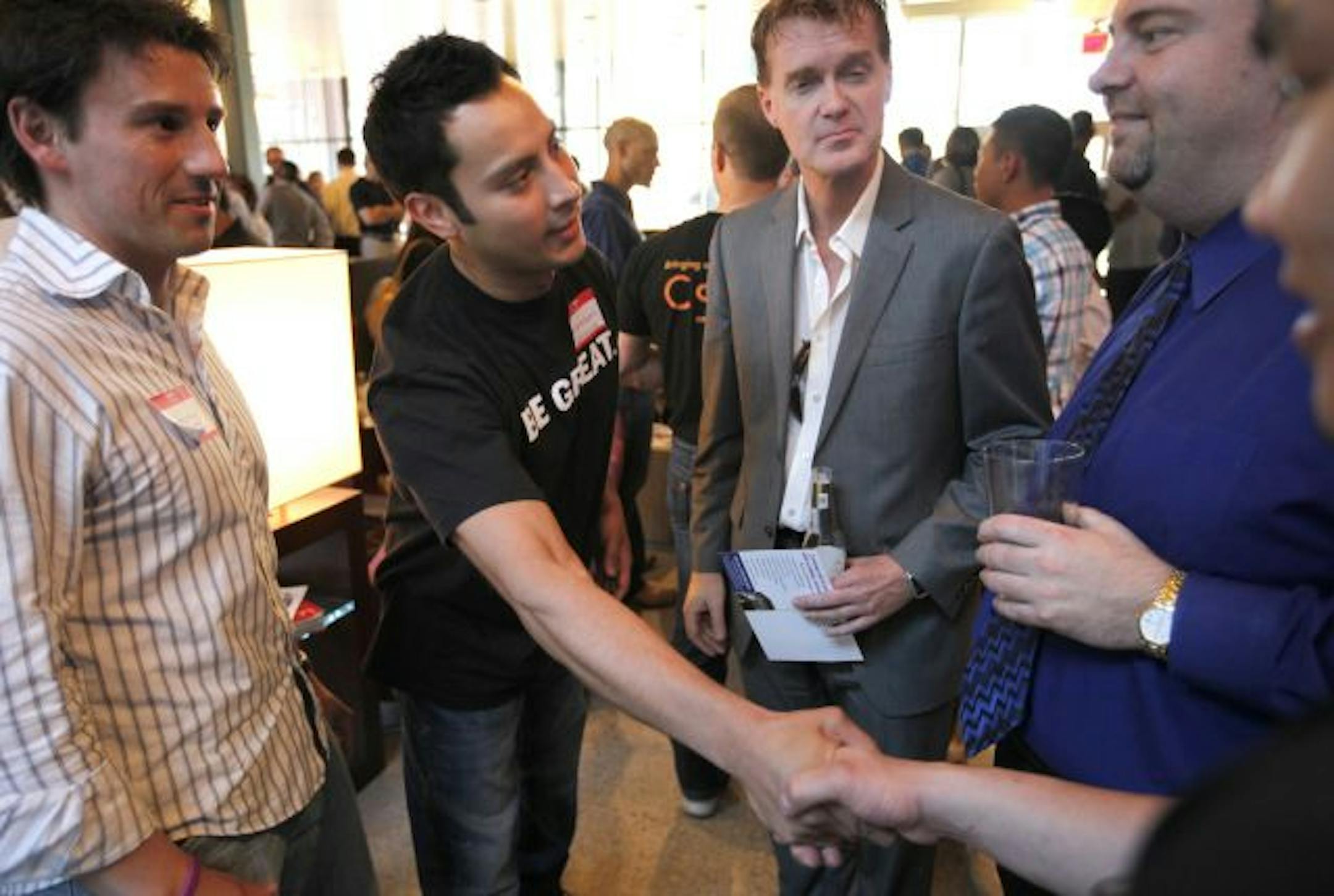 It's all about working the room. Jessie Ramirez shakes hands and promotes his charity, The Boys and Girls Club on the West Side of St. Paul. He works for Bell Home Reality and Aqua Nightclub.