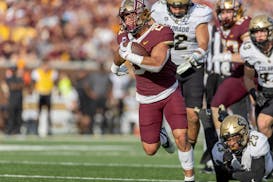 Minnesota’s running back Bryce Williams (21) runs to the end zone for a touchdown in the fourth quarter against Colorado at Huntington Bank Stadium 