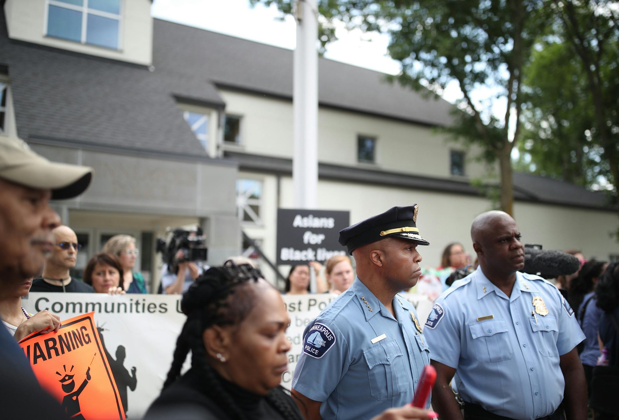 Minneapolis Police Chief Medaria Arradondo left, listened as north side community members held a protest and rally at the 4th precinct on Plymouth avenue in response to the shooting death of Thurman Blevins by Minneapolis Police Sunday June 24, 2018 in Minneapolis , MN. ] JERRY HOLT &#xef; jerry.holt@startribune.com