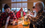 Aaron Przybylski and Bob Anderson enjoyed a pleasant chat over a beer at the St. Paul Fly Tiers' gathering at Summit Brewing Co. Anderson, 69, has bee